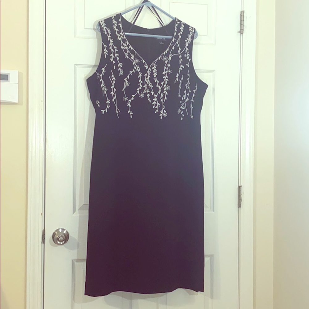 Black sleeveless dress w/ white embroidery